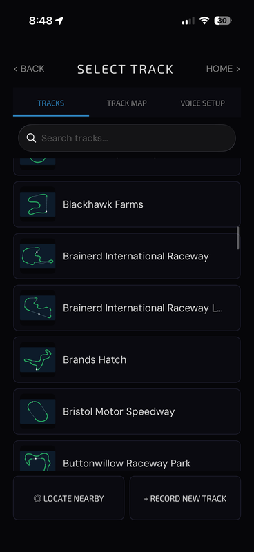 Track selection screen with search and the 90+ built-in track library