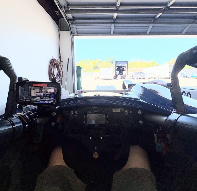 My Spec Racer Ford cockpit: the phone on a RAM roll-bar mount clamped to the left side tube, running the RaceVoice live HUD, camera looking down the nose.